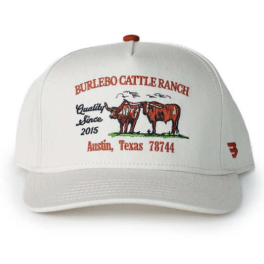White cap with red and black text and graphics on a white background
