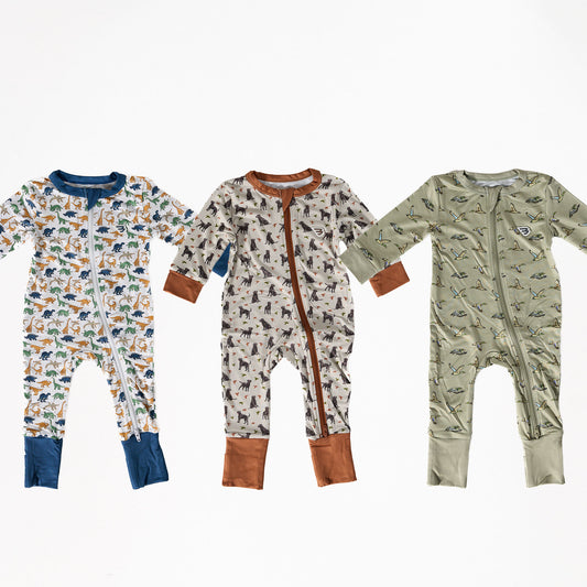 Three children's onesies with different animal print designs on a white background