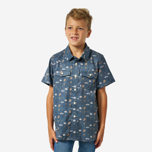 Boy wearing the Desert Night Youth Performance Western Shirt, slate blue with a western print, front view