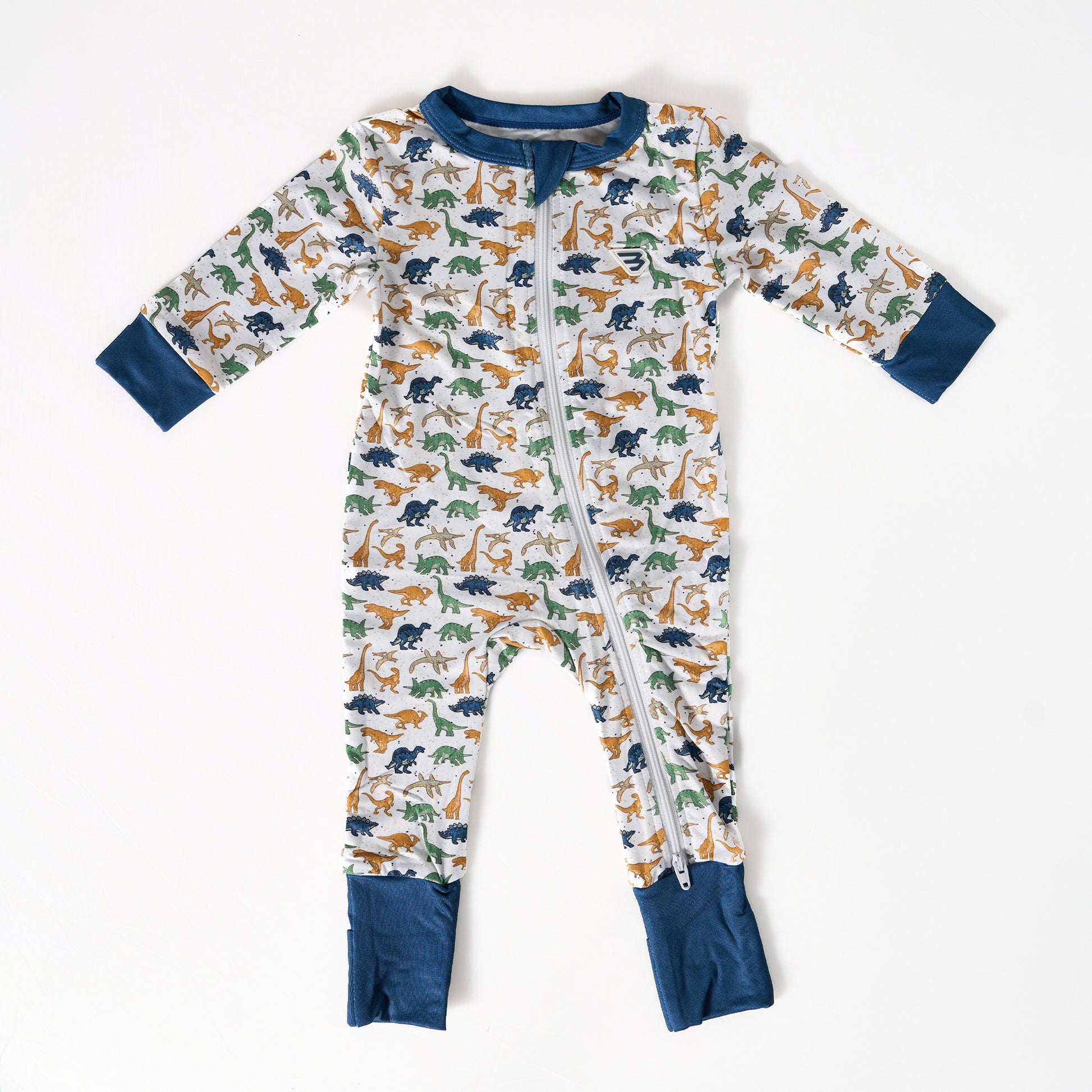 Children's onesie with dinosaur pattern on a white background