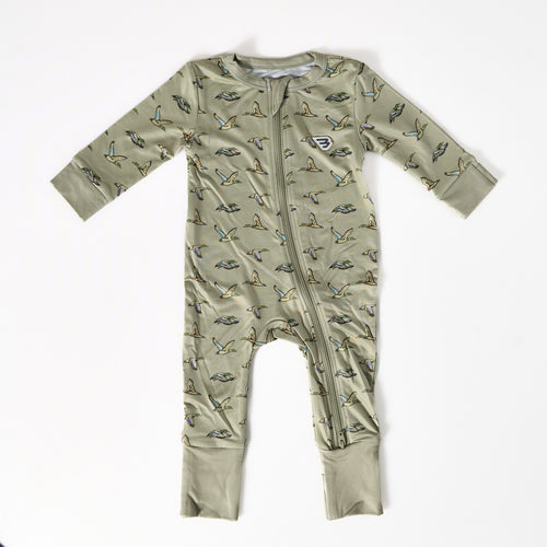 Green baby onesie with bird pattern on a white background