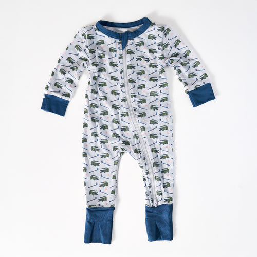 Children's onesie with dinosaur pattern on a white background