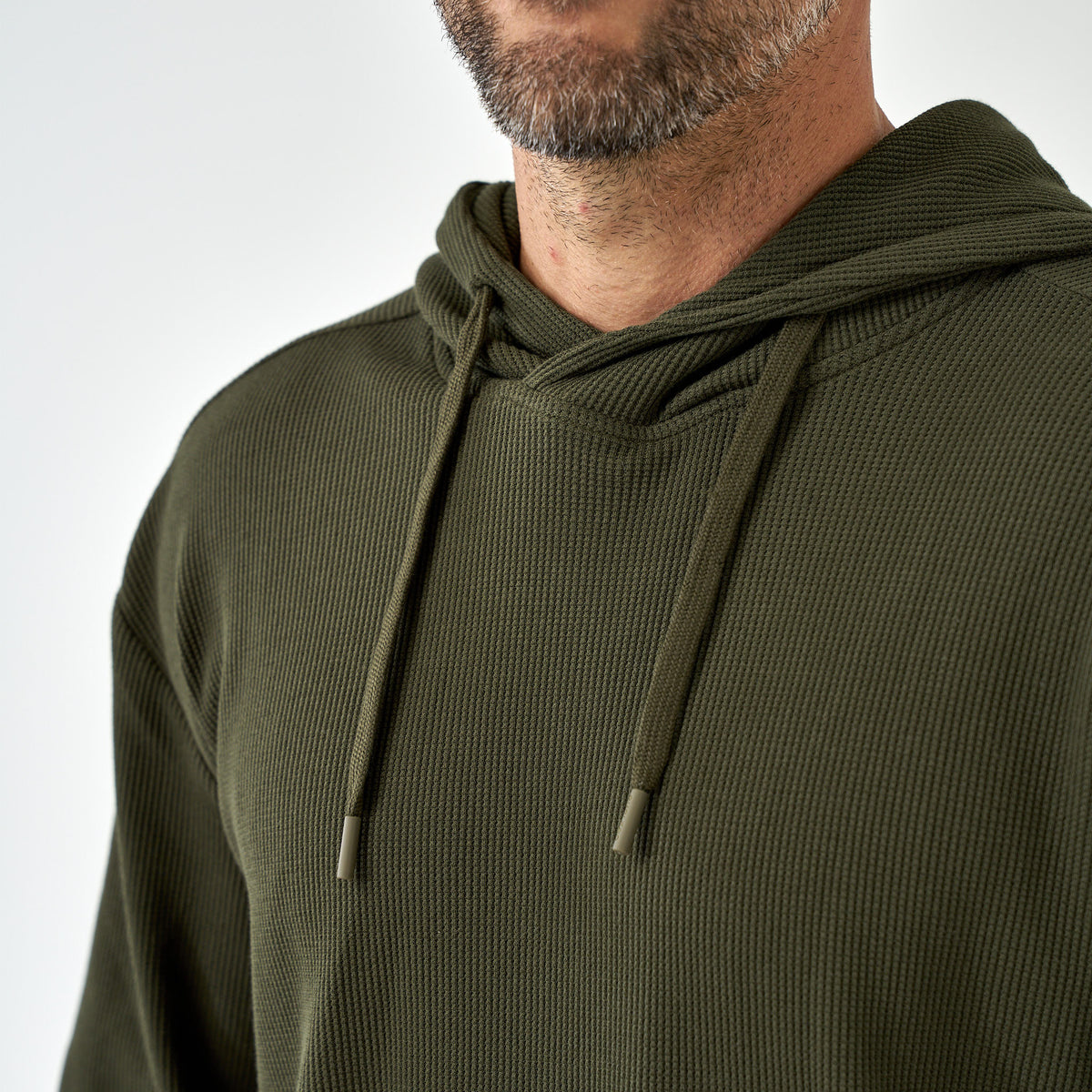 Close-up of the Mallard Green Thermal Hoodie hood and drawstrings with waffle knit texture